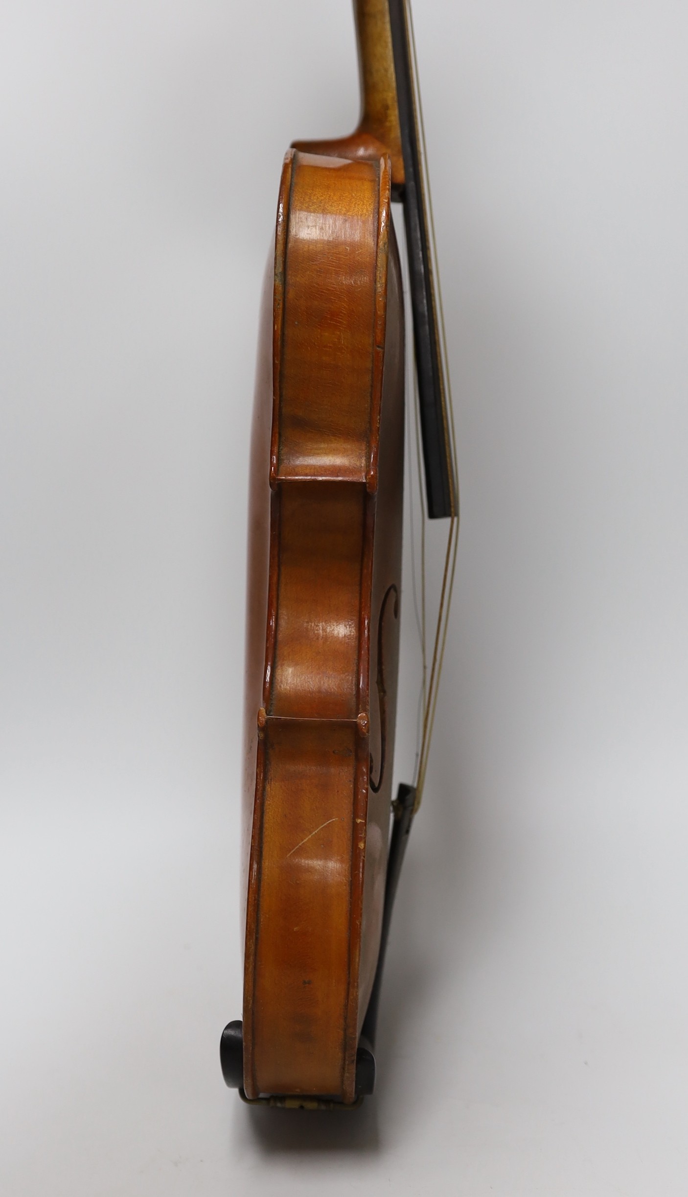 An early 20th century Stainer violin, patent number 23140, back measures 36.5cm excl button. cased